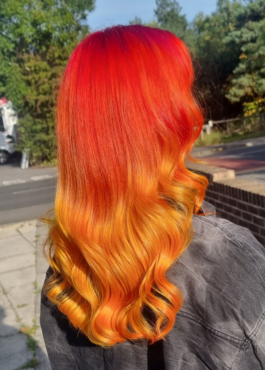 Vivid orange and red colour by Mandy at Helen Griffin Hair & Nails